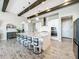 Modern kitchen with white cabinets, stainless steel appliances, and an island at 13028 Homestead Ln, Parrish, FL 34219