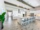 Modern kitchen with white cabinets, large island, and stainless steel appliances at 13028 Homestead Ln, Parrish, FL 34219
