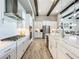 Modern kitchen with white cabinets, stainless steel appliances, and a large island at 13028 Homestead Ln, Parrish, FL 34219