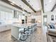 Modern kitchen with white cabinets, large island, and stainless steel appliances at 13028 Homestead Ln, Parrish, FL 34219