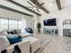 Open living area featuring a sectional sofa, TV, and fireplace at 13028 Homestead Ln, Parrish, FL 34219