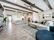 Open concept living room with kitchen views and light tile floors at 13028 Homestead Ln, Parrish, FL 34219