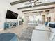 Open living area with kitchen views and ceiling beams at 13028 Homestead Ln, Parrish, FL 34219