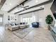Spacious living room with L-shaped sectional sofa and fireplace at 13028 Homestead Ln, Parrish, FL 34219