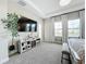 Main bedroom with a large TV and fireplace at 13028 Homestead Ln, Parrish, FL 34219