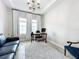 Home office featuring a comfy couch and work desk at 13028 Homestead Ln, Parrish, FL 34219