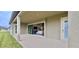 Covered patio offering outdoor living space with backyard access at 13028 Homestead Ln, Parrish, FL 34219
