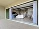Open patio with sliding doors leading to the living area at 13028 Homestead Ln, Parrish, FL 34219