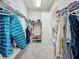 Large walk-in closet with ample shelving and hanging space at 13028 Homestead Ln, Parrish, FL 34219