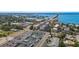 Aerial view showing a multi-unit building near the water at 131 Bluff View Dr # 103, Belleair Bluffs, FL 33770