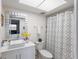 Clean bathroom with a modern vanity and shower/tub combo at 131 Bluff View Dr # 103, Belleair Bluffs, FL 33770