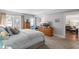 Comfortable bedroom with a king-size bed and access to a balcony at 131 Bluff View Dr # 103, Belleair Bluffs, FL 33770