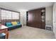 Guest bedroom with a built-in murphy bed and seating area at 131 Bluff View Dr # 103, Belleair Bluffs, FL 33770