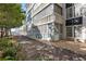 Building exterior showcasing a walkway, landscaping, and building facade at 131 Bluff View Dr # 103, Belleair Bluffs, FL 33770