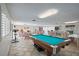 Community room features a pool table, seating, and exercise equipment at 131 Bluff View Dr # 103, Belleair Bluffs, FL 33770