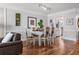 Bright dining room with hardwood floors and view of kitchen at 131 Bluff View Dr # 103, Belleair Bluffs, FL 33770