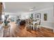 Open concept dining area with hardwood floors and modern furniture at 131 Bluff View Dr # 103, Belleair Bluffs, FL 33770