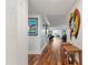 Entryway with hardwood floors, leading to living area at 131 Bluff View Dr # 103, Belleair Bluffs, FL 33770