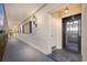 Building hallway with access to apartment entry doors at 131 Bluff View Dr # 103, Belleair Bluffs, FL 33770