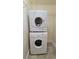 Stackable washer and dryer in a convenient laundry closet at 131 Bluff View Dr # 103, Belleair Bluffs, FL 33770