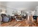 Open concept living room with hardwood floors and comfy seating at 131 Bluff View Dr # 103, Belleair Bluffs, FL 33770