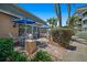 Private patio with seating area and lush landscaping at 131 Bluff View Dr # 103, Belleair Bluffs, FL 33770