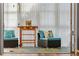 Relaxing sunroom with wicker furniture and decorative rug at 131 Bluff View Dr # 103, Belleair Bluffs, FL 33770