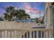 Scenic waterfront view with palm trees and bridge at sunset at 131 Bluff View Dr # 103, Belleair Bluffs, FL 33770