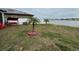 Spacious backyard with a view of a lake and some landscaping at 13828 Tonya Anne Dr, Riverview, FL 33579