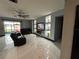 Living area with black leather couches, built-in shelving, and fireplace at 13828 Tonya Anne Dr, Riverview, FL 33579