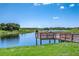 Wooden pier providing lake access at 13916 Reindeer Cir, Hudson, FL 34669