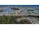 Aerial view showcasing the home's setting in a community by the lake at 1536 W Del Webb Blvd, Sun City Center, FL 33573