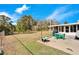 Large backyard with grassy area and patio for outdoor enjoyment at 1536 W Del Webb Blvd, Sun City Center, FL 33573