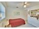 Cozy bedroom with a double bed, world map, and window at 1536 W Del Webb Blvd, Sun City Center, FL 33573