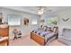 Bright bedroom with a double bed and vintage furniture at 1536 W Del Webb Blvd, Sun City Center, FL 33573