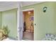 Bright and airy entryway with chandelier and small table at 1536 W Del Webb Blvd, Sun City Center, FL 33573