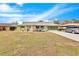 Ranch style home with green exterior, stone accents and driveway at 1536 W Del Webb Blvd, Sun City Center, FL 33573
