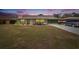 Attractive ranch home with green exterior, stone accents, and landscaping at 1536 W Del Webb Blvd, Sun City Center, FL 33573