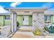 Inviting front entrance with stone pillars and a white door at 1536 W Del Webb Blvd, Sun City Center, FL 33573