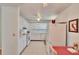 Efficient kitchen with white cabinets and appliances at 1536 W Del Webb Blvd, Sun City Center, FL 33573