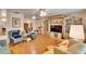 Spacious living room with hardwood floors, comfy seating and built-in shelving at 1536 W Del Webb Blvd, Sun City Center, FL 33573