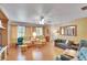Bright and airy living room with hardwood floors, and ample seating at 1536 W Del Webb Blvd, Sun City Center, FL 33573