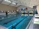 Indoor heated swimming pool with lanes and a clean, modern design at 1536 W Del Webb Blvd, Sun City Center, FL 33573