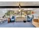 Relaxing sunroom with ample seating and backyard views at 1536 W Del Webb Blvd, Sun City Center, FL 33573