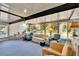 Bright sunroom featuring comfortable seating and backyard access at 1536 W Del Webb Blvd, Sun City Center, FL 33573