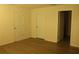 Spacious bedroom with two white doors and a view to another room at 1668 Hazy Sea Dr, Plant City, FL 33565
