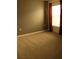 Bedroom with neutral carpet flooring, a large window and dark wall paint at 1668 Hazy Sea Dr, Plant City, FL 33565