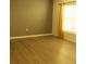 Bedroom with light laminate flooring, a large window with blinds and warm paint at 1668 Hazy Sea Dr, Plant City, FL 33565