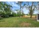 Spacious backyard with lush lawn and wooden fence at 1718 Elise Marie Dr, Seffner, FL 33584