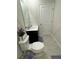 Simple bathroom with toilet, sink, and dark vanity at 178 Brofield St, Brooksville, FL 34604